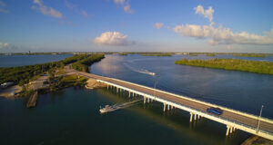 Aerial view of a bridge roadway over water.